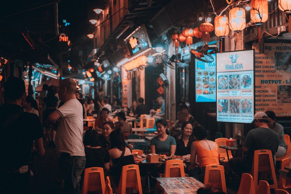 A group of people sitting at tables in a restaurant Vietnam